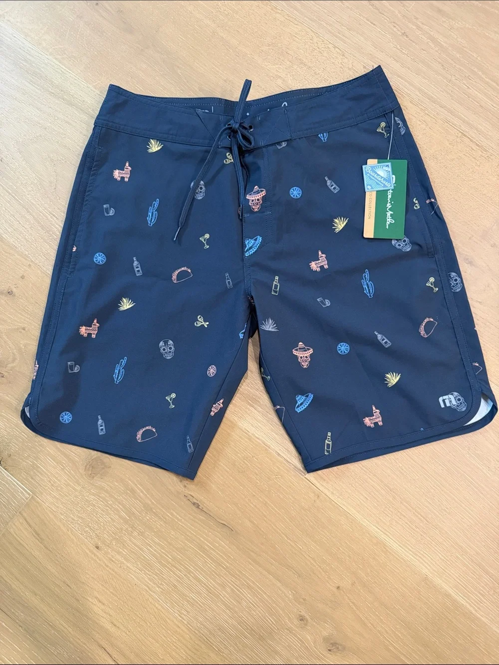 Travis Mathew Navy Swim Board Shorts with Multicolor Mini Prints